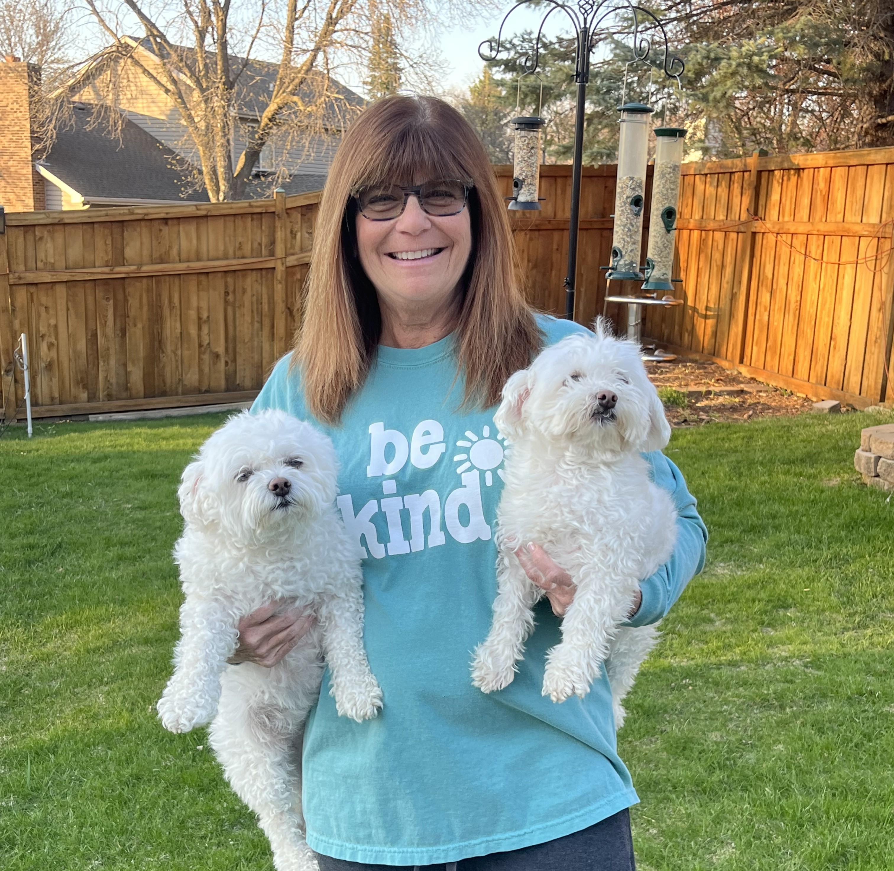 Kori Savitt holding dogs